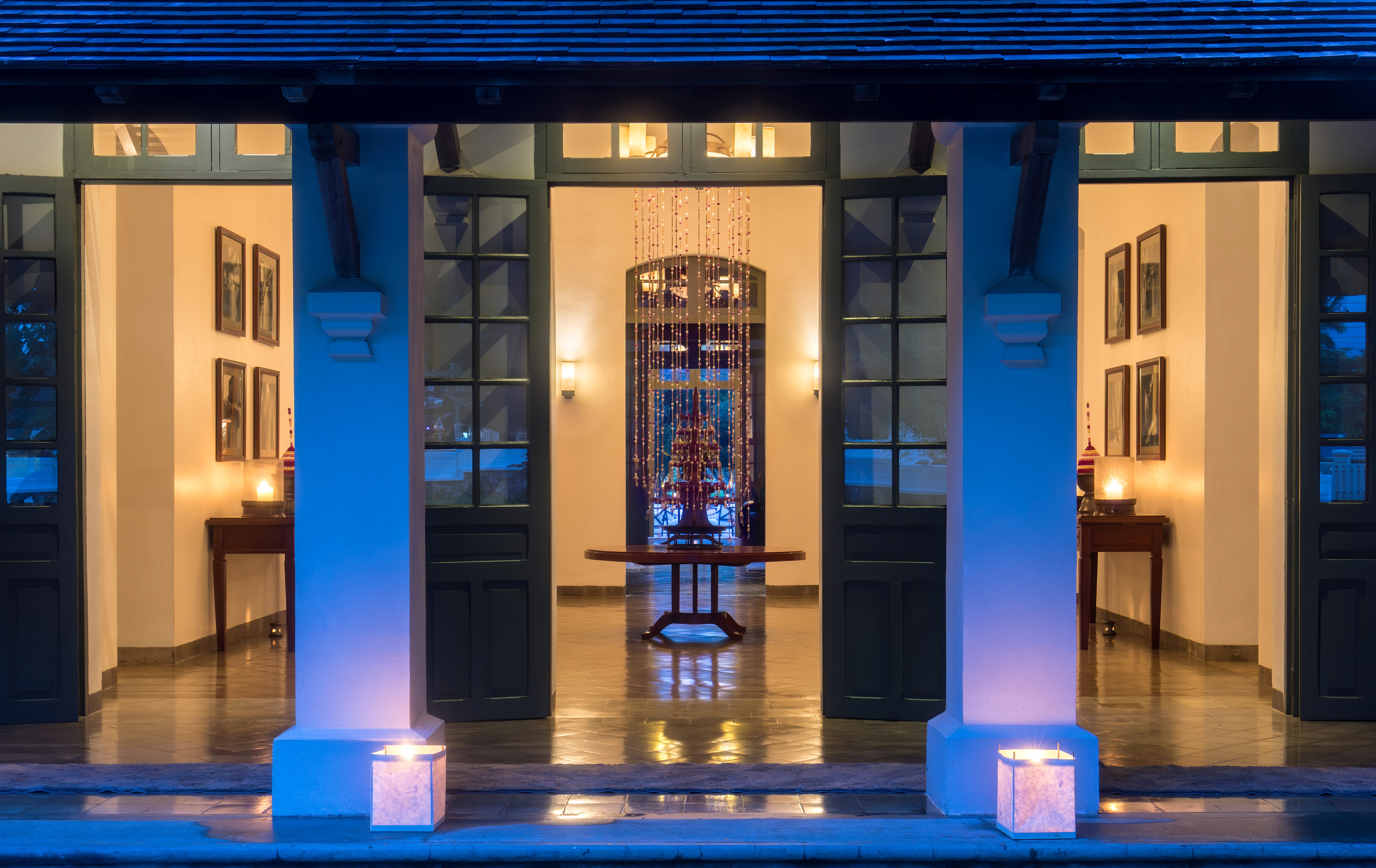 Warm hotel lobby with classic seating and soft lighting