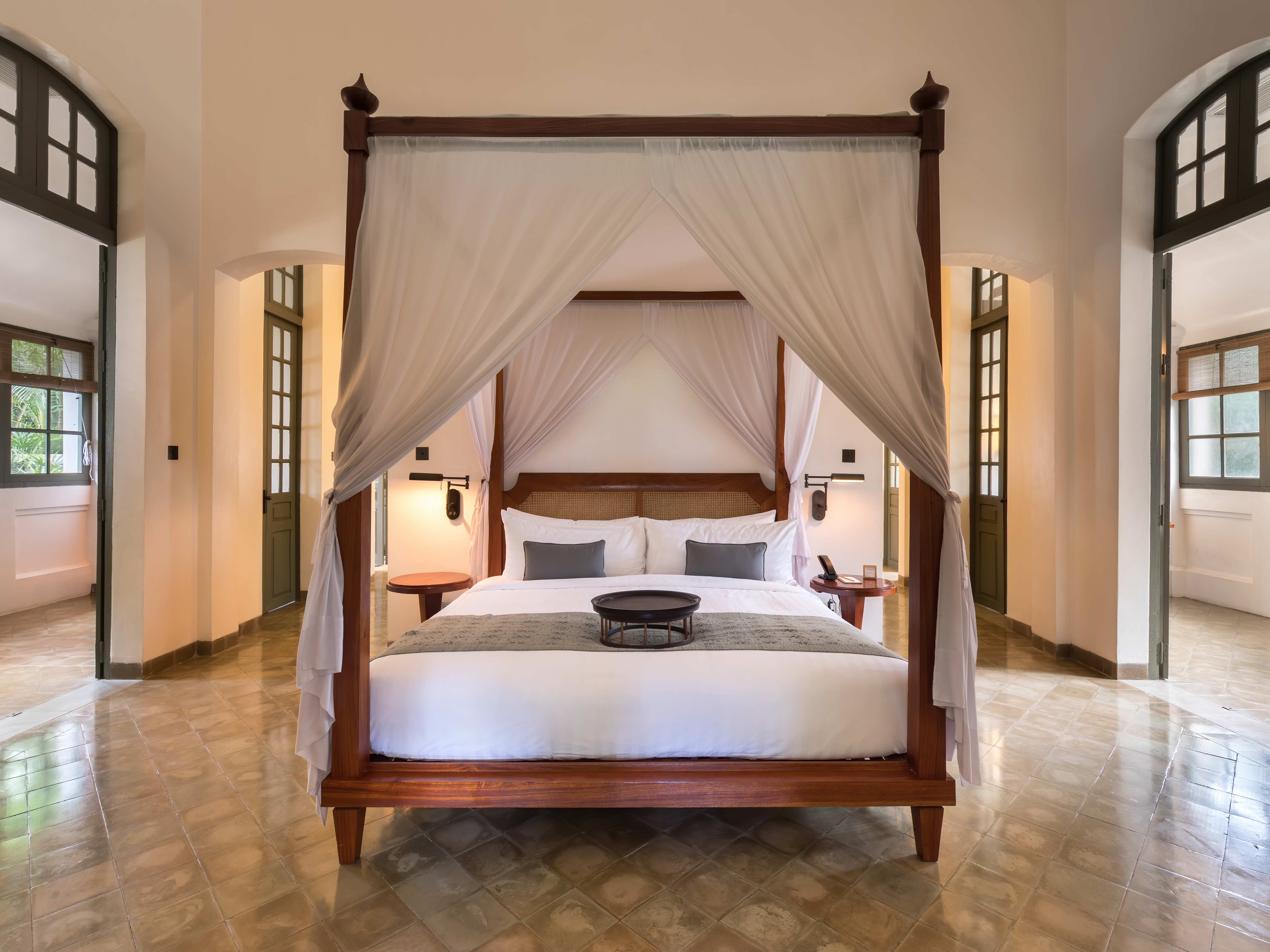 Guest room with a canopy bed and elegant classic details